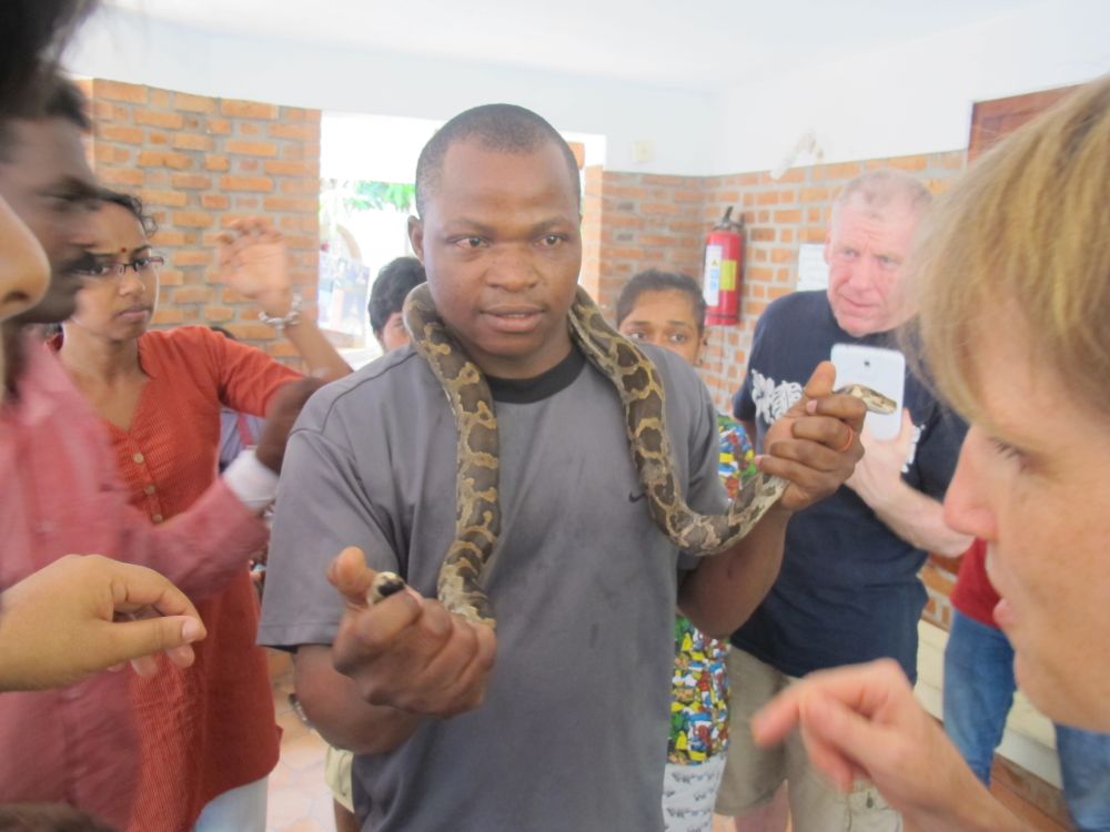 Emmanuel Mruu from Kenya holds up a snake during Vava's visit in 2016