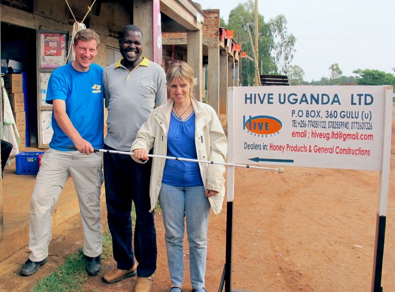 paul kronenberg, Ojok Simon (Founder of Hive Uganda),and Sabriye Tenberken in Gulu in front of Ojok's office