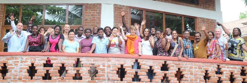 2015 participants along with catalysts waving hands from the balcony of our auditorium