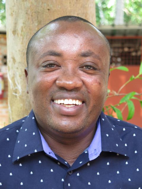 Smiling picture of John Mwangi