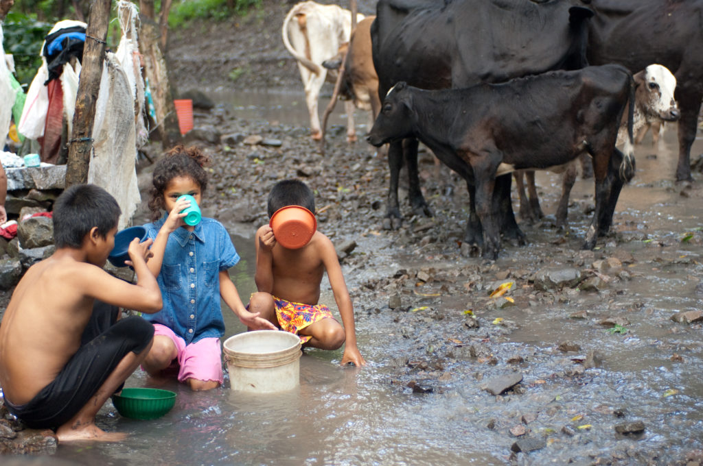 Kids drinking dirty water