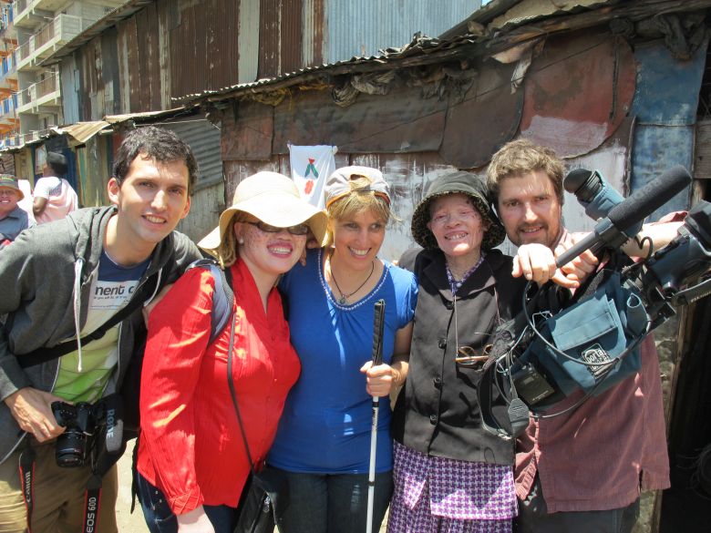 Jayne Waithera (in red) advocates for People with Albinism